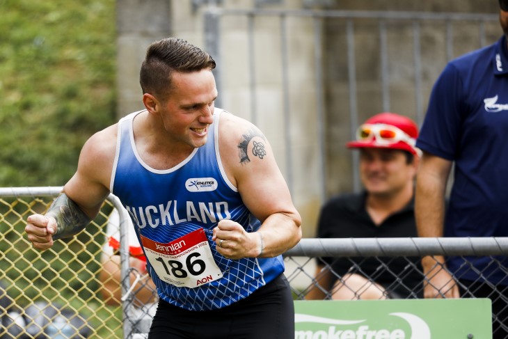 Mitch celebrates on the track after sprinting.