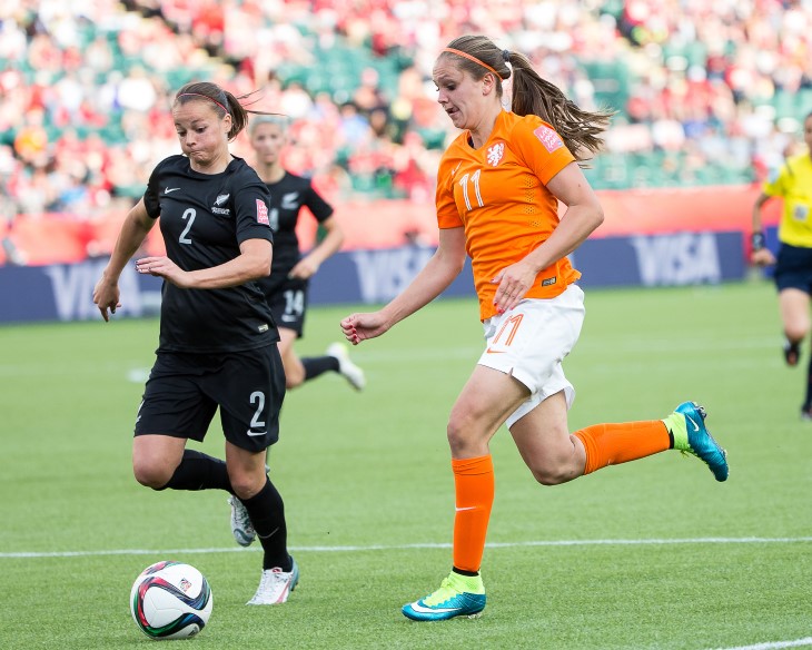 Ria playing football for the NZ Ferns.