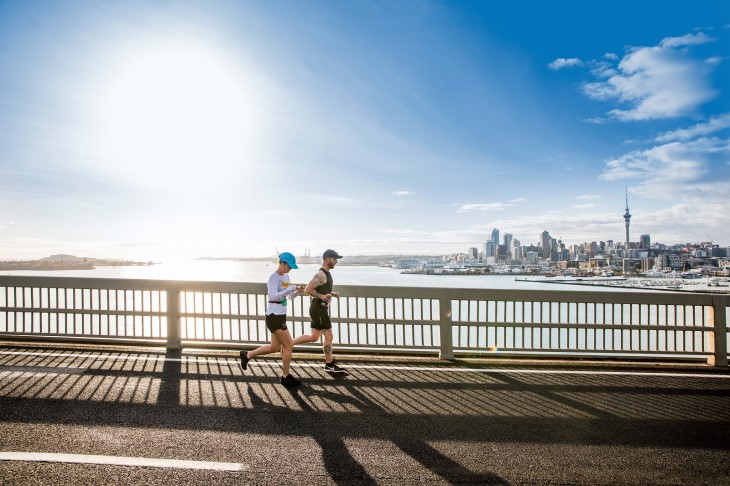 A pair of runners running over the Auckland Harbour Bridge during the Auckland Marathon.