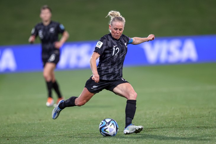 Football Ferns midfielder Betsy Hassett kicking the ball. 