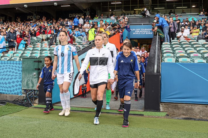 Betsy Hassett leads the Football Ferns out as captain against Argentina at North Harbour Stadium. 