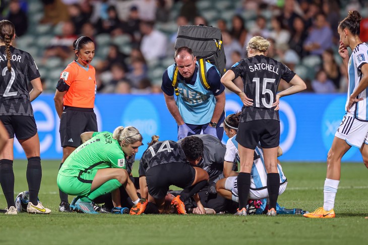 Betsy Hassett being treated after breaking her nose against Argentina. 