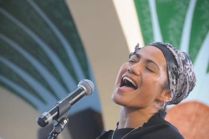 A close-up photo of Betty-Anne Hall singing.