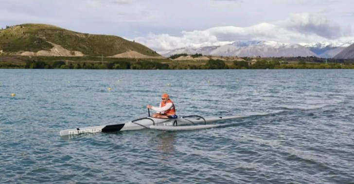 Brendon Timmins paddling in his waka on the harbour.