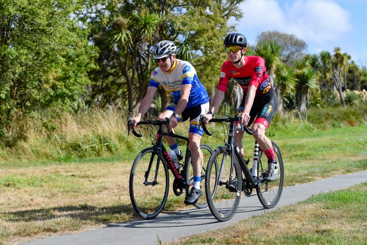 Brendon Vercoe riding his bike with a training partner. 
