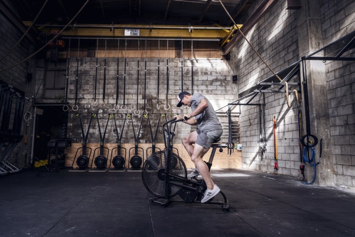 Brook Macdonald working out on an exercise bike.