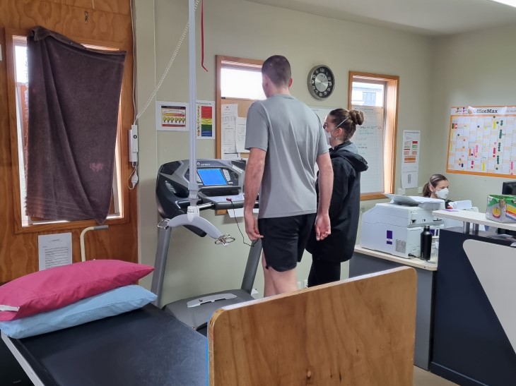 Campbell Gray walking on a treadmill during his recovery. 