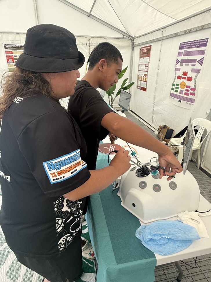 A pair of young people doing a medical exercise at the Hauora Hub.