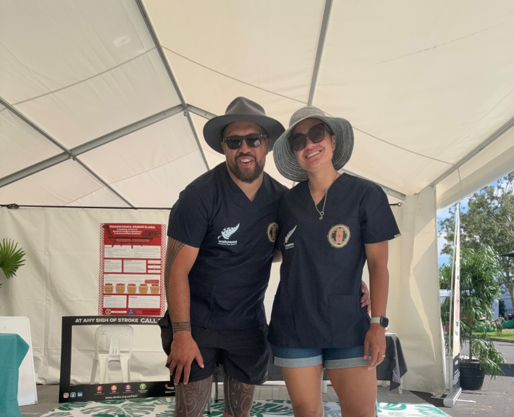 Dr Jamie-Lee Rahiri standing in the Hauora Hub at the Waka Ama Sprint Nationals with her husband Dr 