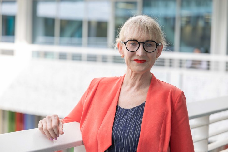 Dr Jo Prendergast standing at balcony.