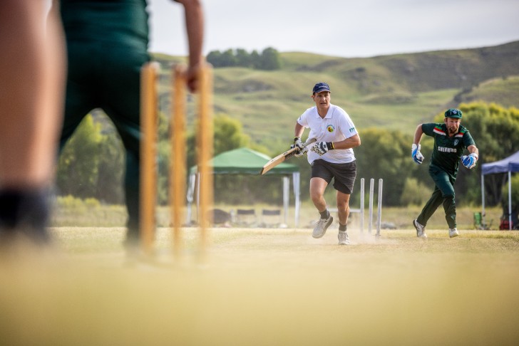 A batsman setting off for a run after hitting the ball during the Gumboot Cup