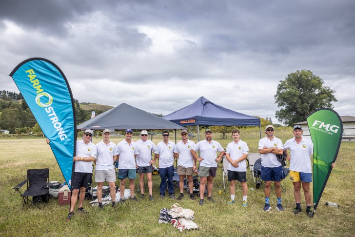 A group of players lining up for a photo on the field at the Gumboot Cup.