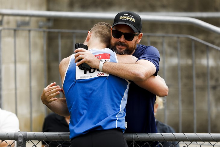 Para sport coach Hamish Meacheam hugging one of his athletes after a competition. 