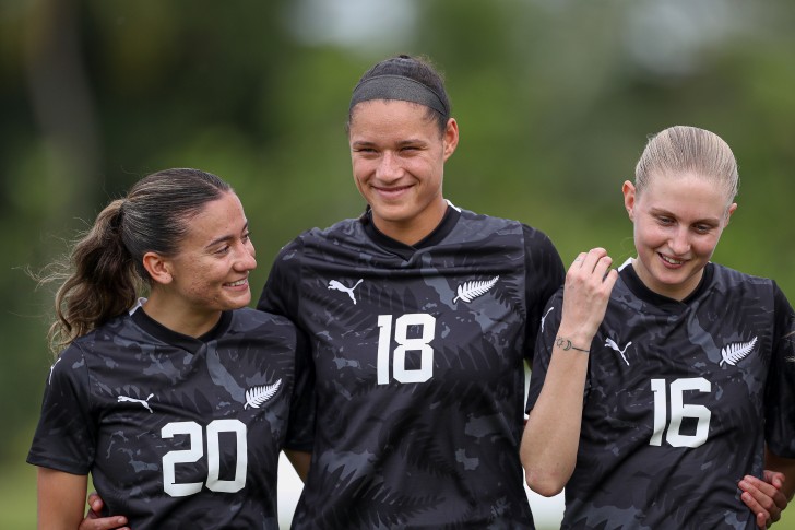 Indiah-Paige Riley standing with her Football Ferns team-mates Grace Jale and Jacqui Hand.