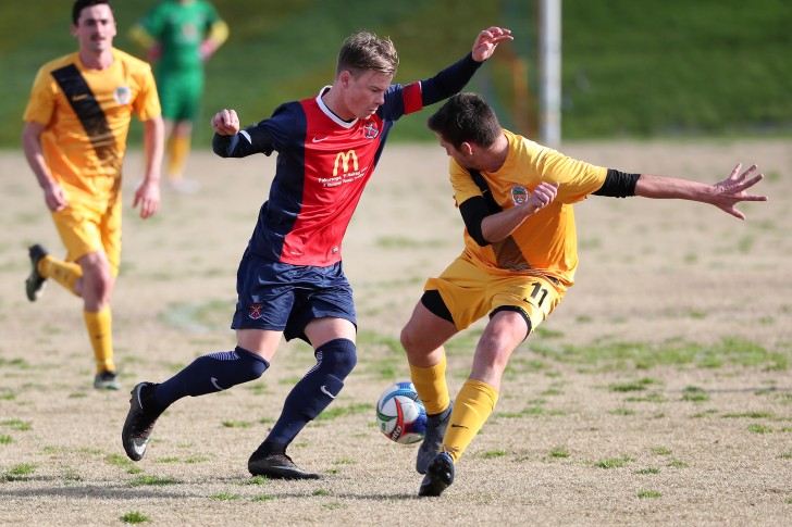 Jarrod Young moving past an opponent with the ball.