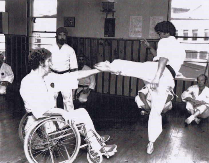John Marrable practicing karate in his wheelchair in 1980.