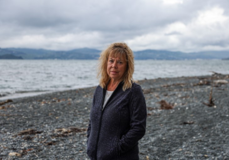 Karen Skellett standing on the beach