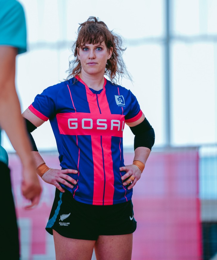 MacKenzie Falco standing on the futsal court with her hands on her hips.