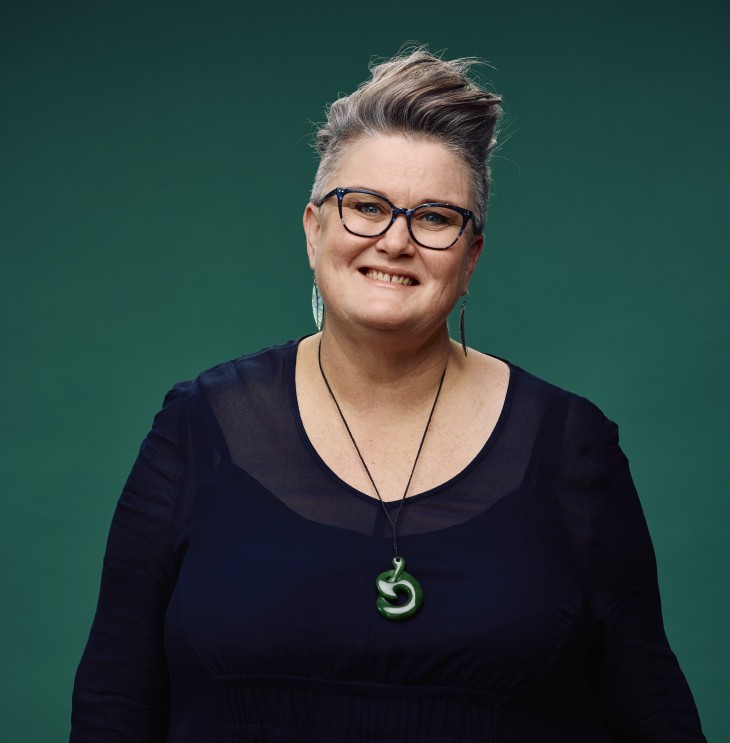 A portrait photo of Rachel Harrison in front of a green background.