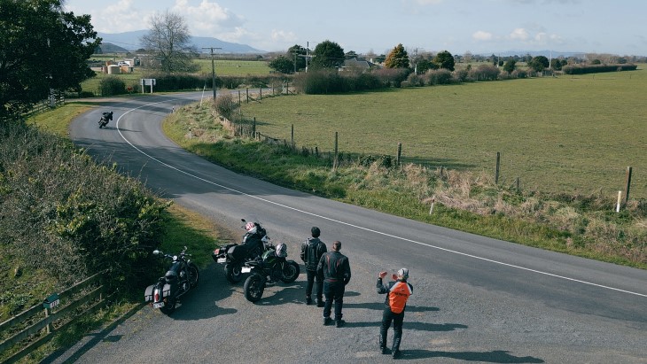An instructor teaching a group of motorbike riders on a Ride Forever course. 