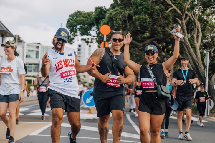 Several people pose for the camera while walking Round the Bays. 