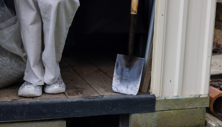 Spade next to doorway 