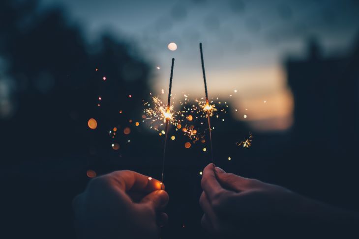 Sparklers held by two hands