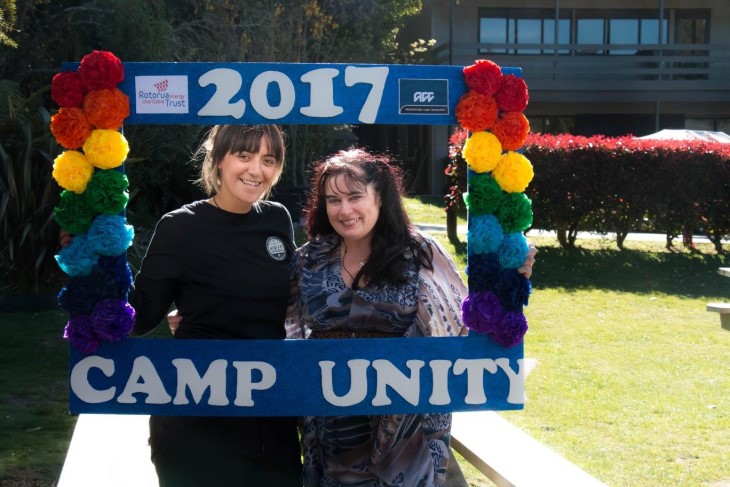 Te Rina and her Camp Unity co-founder standing and smiling at the camera. 