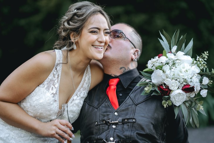 Raymond Ruru kisses his sister Te Rina Ruru-Pelasio on her wedding day.