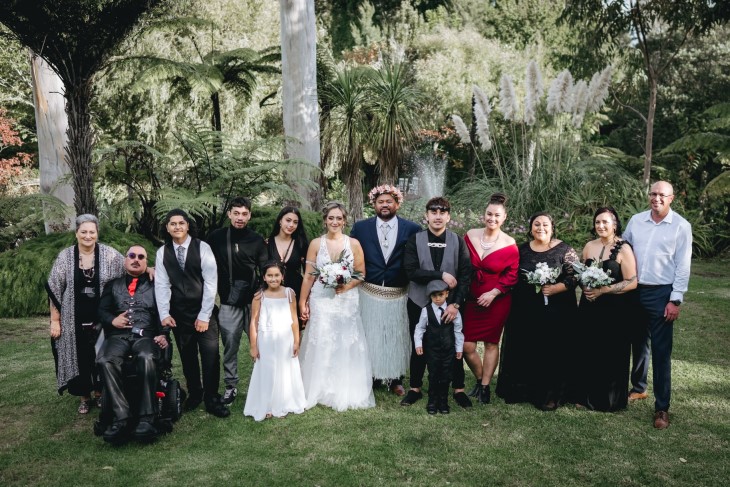 Te Rina Ruru-Pelasio with Raymond Ruru and her whānau on her wedding day. 