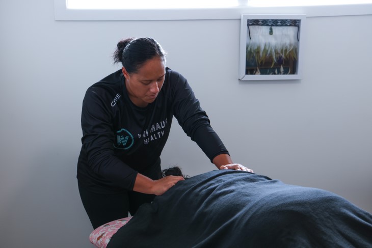 Wai Mauri team member Ioana Marsters using her healing methods on a client.