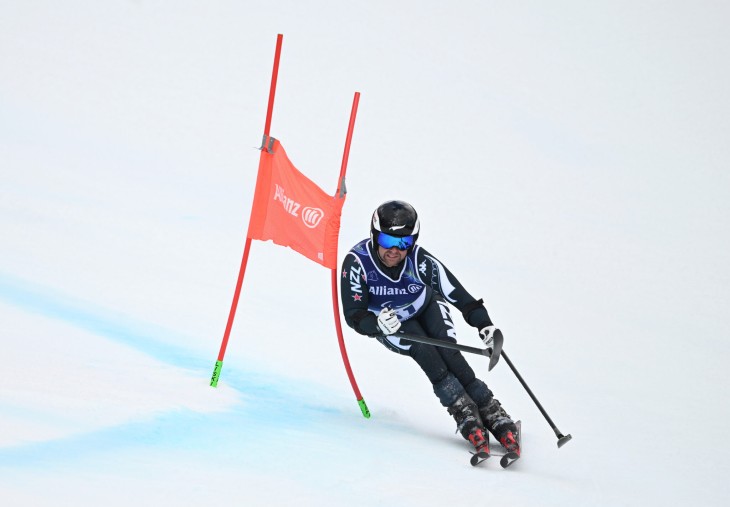 Adam Hall skiing down a slope at the Winter Paralympics.